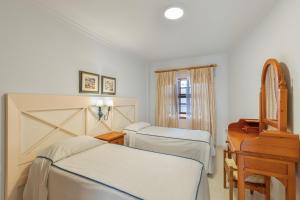 Postel nebo postele na pokoji v ubytování Playa Delphin 302