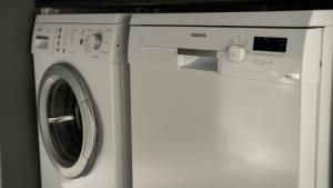 a white washer and dryer in a room at Essea House in Wilderness