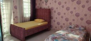 En eller flere senge i et værelse på Flamingo Suites and BnB