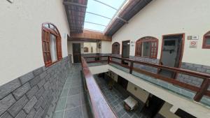 an empty hallway of a building with a skylight at Recanto do Abraao in Abraão