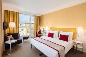 En eller flere senge i et værelse på OREA Hotel Andels Depandance