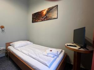Postel nebo postele na pokoji v ubytování Aparthotel Mariazellerhof