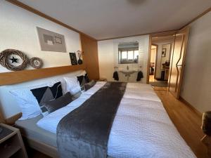 En eller flere senge i et værelse på Apartment Bergfreude