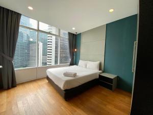 En eller flere senge i et værelse på Kuala Lumpur City Center Residence + 29 billeder