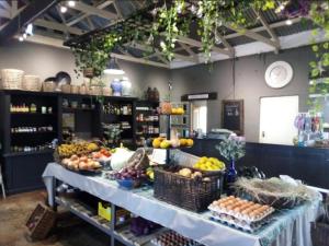 a display of fruits and vegetables on a table in a store at Lionsgate Estate Cottage in Dargle
