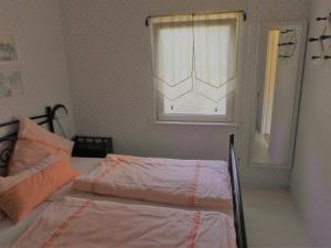 Postel nebo postele na pokoji v ubytování Ferienbungalow Fleesensee