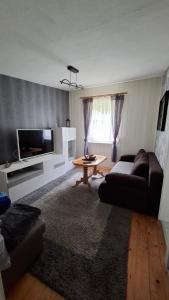 a living room with a couch and a table at Haus in Malchow in Malchow