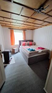 a bedroom with a bed and a wooden ceiling at Haus in Malchow in Malchow
