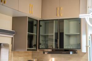 Kuchyň nebo kuchyňský kout v ubytování Ivys Cozy Homes Kampala B6