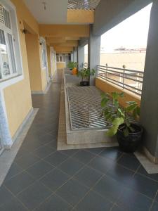 a hallway of a building with plants on it at Studio BNB Meru town CBD in Meru