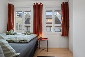En eller flere senge i et værelse på Premium House Øvre Langgate 27