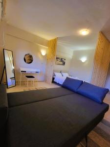 a living room with a couch and a table at Despina's house in Ioannina