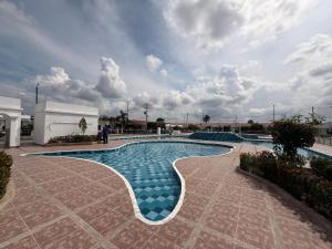 Bazén v ubytování Casa condominio Dubai Flandes nebo v jeho okolí