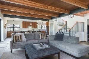 a living room with a couch and a table at Stay at Old Garden Beach in Rockport +10 photos