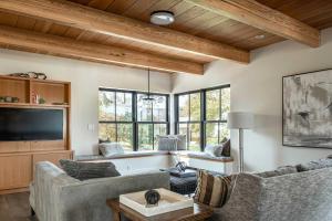 a living room with two couches and a tv at Stay at Old Garden Beach in Rockport