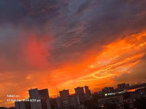 a city skyline with a sunset in the sky at Dream Land in Lagos