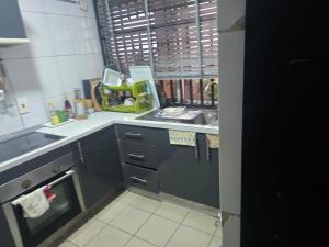 a kitchen with a sink and a counter top at Dream Land in Lagos