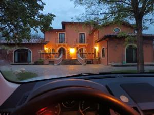 a car driving in front of a house at La Terra di Gaia in Magliano deʼ Marsi