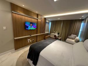 TV/trung tâm giải trí tại Estúdio em Condo. Frente Mar OPS0337