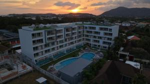 an aerial view of a building with a swimming pool at Babylon Sky Garden 2 in Rawai Beach