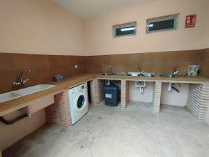 Kuchyň nebo kuchyňský kout v ubytování Camping Las Aguas