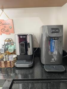 a coffee maker sitting on top of a counter at Flat Apartamento Av Esmeralda em Marília in Marília +13 photos