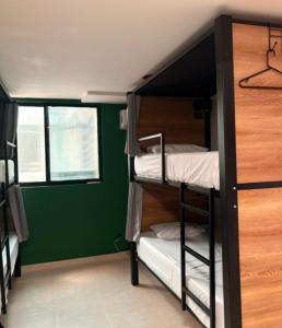 Ένα ή περισσότερα κρεβάτια σε δωμάτιο στο Bohemia Boutique Hostel