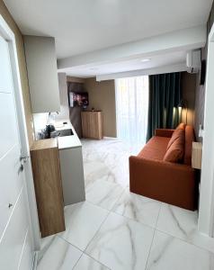 a kitchen and a living room with a couch and a sink at Las Americas 200A apartment in Costa de Adeje