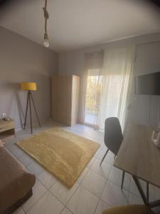 a living room with a couch and a table at Dimi's home in Komotini