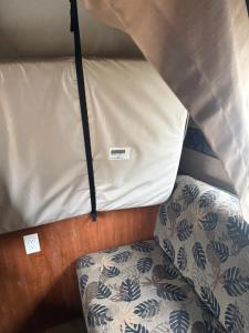 een bed in een kamer met een matras en een kussen bij Ver-El RV Park & Campground in Concord