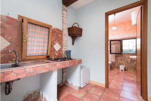 a kitchen with a sink and a stone wall at La Tenuta - Resort Agricolo in Casaprota +65 photos