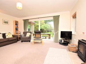 a living room with a couch and a tv at 4 Bed in Cromer oc-kt116 in Cromer