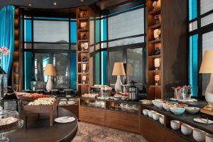 a buffet at a hotel with food on display at Nuvole Garden Hotel in Brunate
