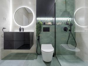 a bathroom with a shower and a toilet and a sink at Arhitect INN in Sibiu