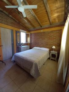 Postel nebo postele na pokoji v ubytování Complejo cabañas Victor II