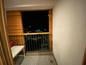 a room with a window with a large television at Bjelašnica Babin do Apartman in SJJ