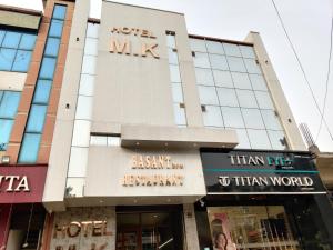 a building with a sign that reads refer mix at Hotel M K in Pathānkot