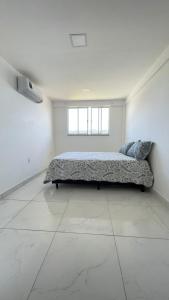 En eller flere senge i et værelse på Casa 2 quartos Mirante Piratininga + 29 billeder