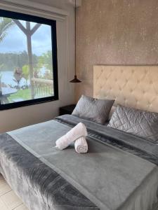 Giường trong phòng chung tại Entre Aguas Hotel