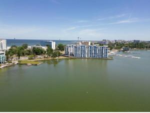 an aerial view of a large body of water with buildings at Lake On Exclusive in Mamaia