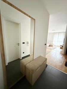 a living room with a couch and a mirror at Bulevar Pent in Sarajevo +2 photos