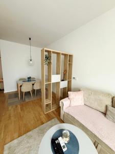 a living room with a couch and a table at Bulevar Pent in Sarajevo