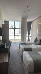 En eller flere senge i et værelse på غرف بالقرب من الحرمHotel Near Masjid nabawi