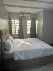 Ένα ή περισσότερα κρεβάτια σε δωμάτιο στο Onicron Guest Inn