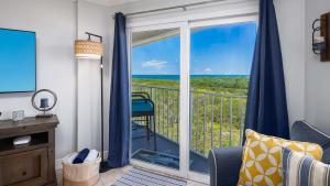 a living room with a view of the ocean at Saltair Loft Ocean Pointe 2 BR 2 BA 1411 in Tavernier