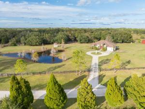 an aerial view of an estate with a pond at Pondfront Ranch • Theater Room • Sleeps 8 in Eagle Lake