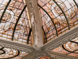 a ceiling with a painting of animals on it at Hôtel Vernet Champs Elysées Paris in Paris