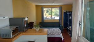 a living room with a couch and a window at Terraza Amecameca in Amecameca de Juárez