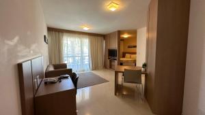 a living room with a couch and a table at The Sun Full Condominiun in Brasília