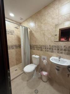 Et badeværelse på Квартири ЦЕНТРАЛ